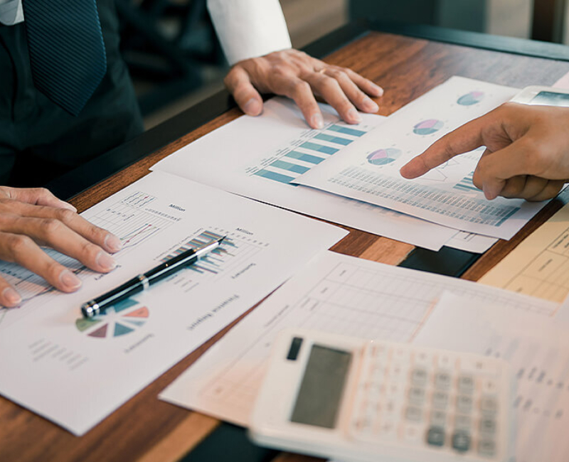 Business owners review financial reports of their business